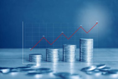Stacked coins with upward trend graph