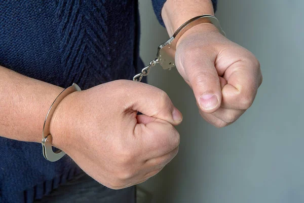 Male hands cuffed in close-up — Stock Photo, Image