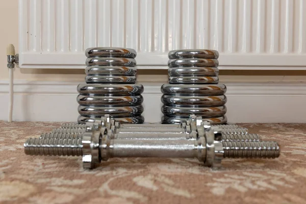 Close up of weight lifting equipment on the floor at home