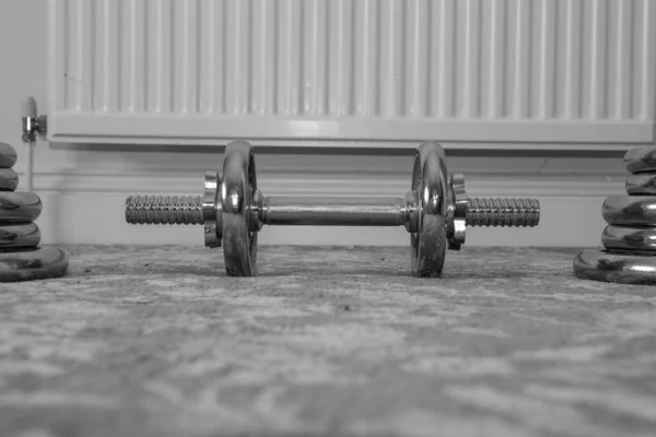 Black White Photo Small Dumbbell Floor Home Bigger Weights Stacked — Stock Photo, Image