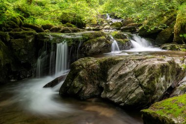 Long exposure of a waterfall on the Hoar Oak Water river at Watersmmeet in Exmoor National Park