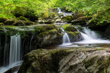 Long exposure of a waterfall on the Hoar Oak Water river at Watersmmeet in Exmoor National Park
