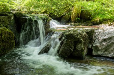 Long exposure of a waterfall on the Hoar Oak Water river at Watersmmeet in Exmoor National Park