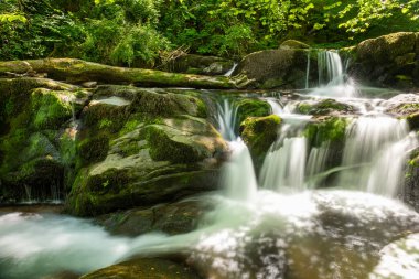 Long exposure of a waterfall on the Hoar Oak Water river at Watersmmeet in Exmoor National Park
