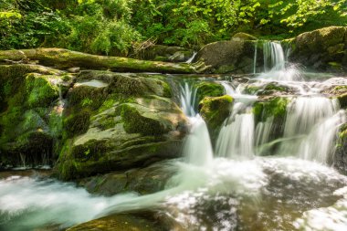 Long exposure of a waterfall on the Hoar Oak Water river at Watersmmeet in Exmoor National Park