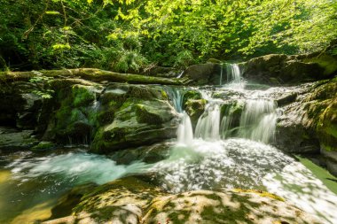 Long exposure of a waterfall on the Hoar Oak Water river at Watersmmeet in Exmoor National Park