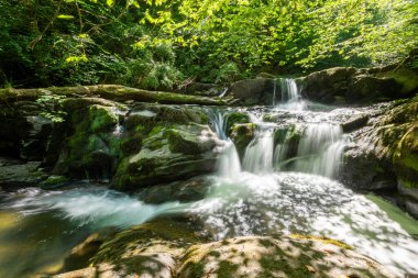 Long exposure of a waterfall on the Hoar Oak Water river at Watersmmeet in Exmoor National Park