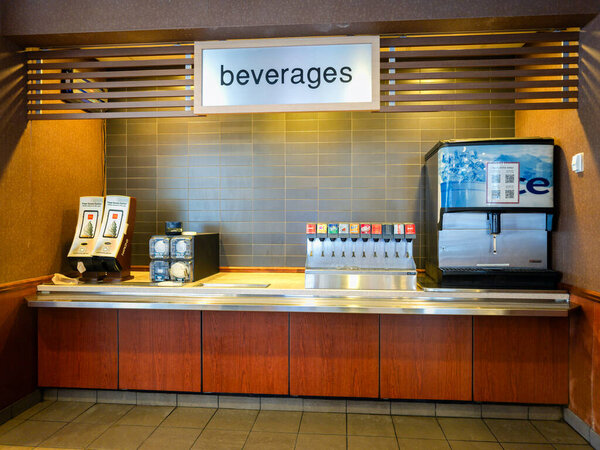 Utica, NY - Dec 9, 2025: Close-up view of McDonald's beverage station self-service soda and coffee dispensers, currently out of order, inside a fast food restaurant