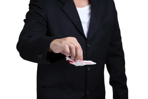 Businessman  holding airplane — Stock Photo, Image