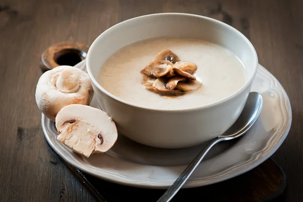 Mushroom cream soup on a wooden background — Stock Photo, Image