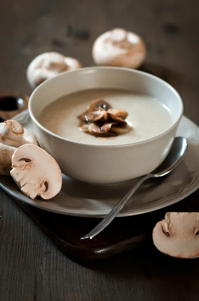 Mushroom cream soup on a wooden background — Stock Photo, Image