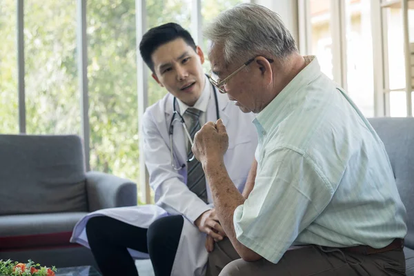 Asian Fat old man meets a doctor at clinic. A white-haired senior man consulting doctor about health at nursing home. Retired male medical consultation By specialist psychiatrist At mental hospital