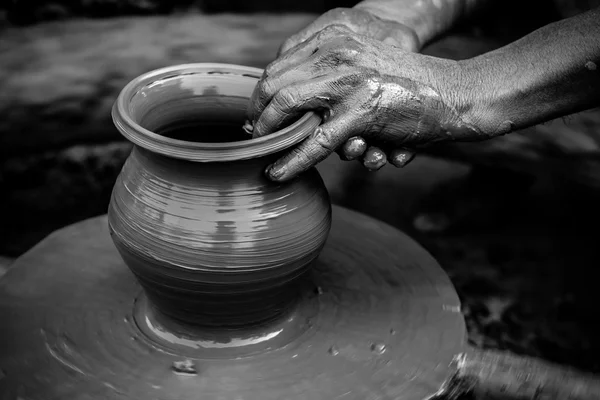 Potter making earthen pot