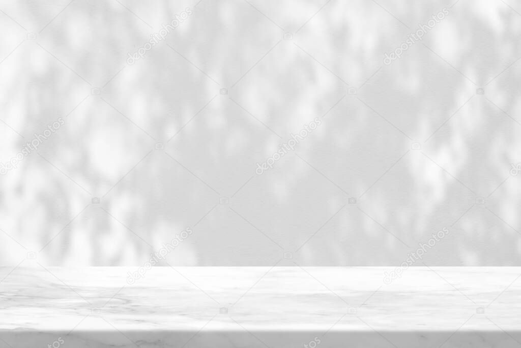 White Marble Table with Tree Shadow on Concrete Wall Texture Background, Suitable for Product Presentation Backdrop, Display, and Mock up.