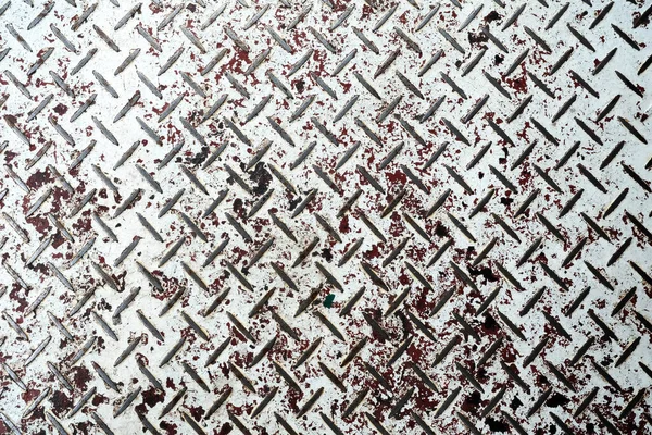 White Grunge Painting on Metal Diamond Plate Texture Background.