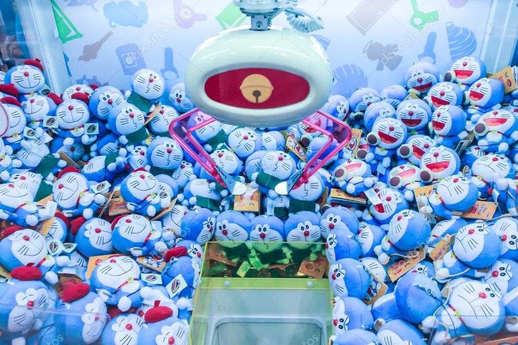 Doraemon dolls in toy crane machine. – Stock Editorial Photo