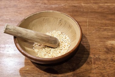 Grinding White Sesame Seeds in a Traditional Japanese Mortar.