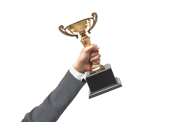 Ręka biznesmena trzyma trofeum złoty — Zdjęcie stockowe