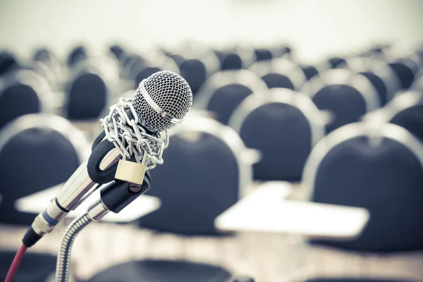 A chained microphone  on cahirs backgroun — Stock Photo, Image