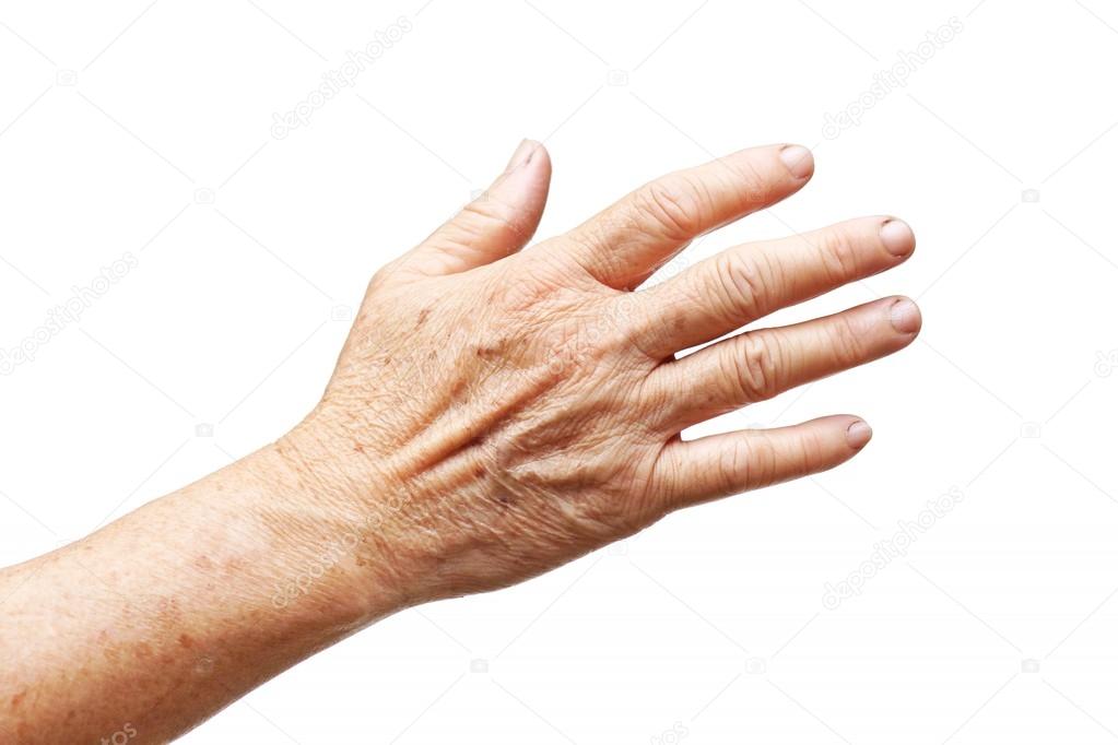 Old female hand full of freckles 