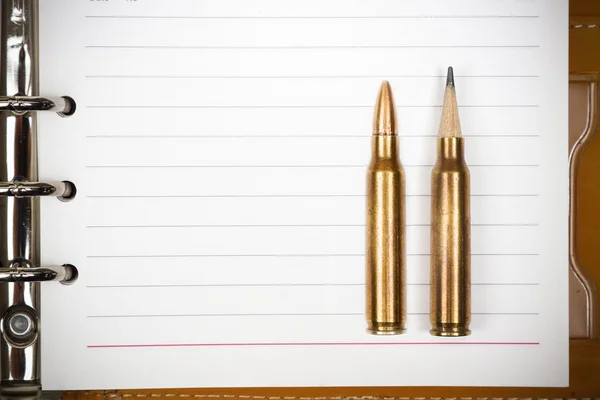 Rifle bullet with a pencil at the head — Stock Photo, Image