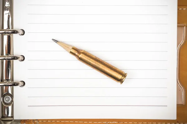 Rifle bullet with a pencil at the head — Stock Photo, Image