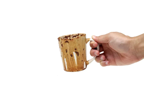 Hand hält eine schmutzige Tasse — Stockfoto