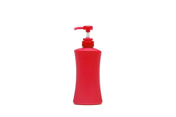 Красная бутылка с насосом — стоковое фото