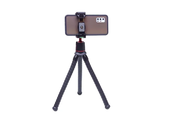 Ein Smartphone Auf Einem Stativ Isoliert Auf Weißem Hintergrund Stockbild