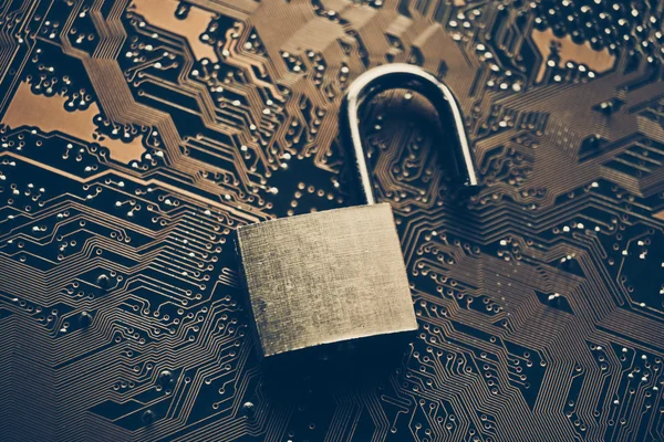 Unlock security lock on circuit board — Stock Photo, Image