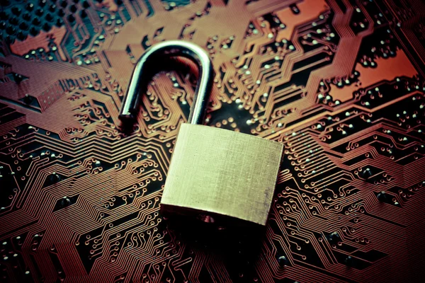 Unlock security lock on circuit board — Stock Photo, Image