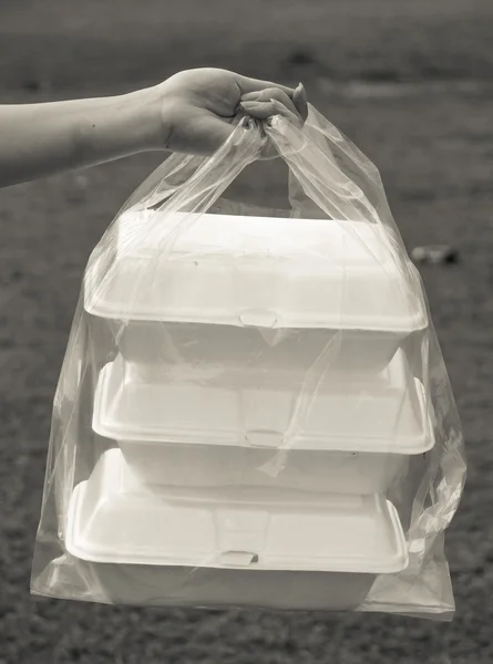 Schuim containers in duidelijke plastic zakken — Stockfoto
