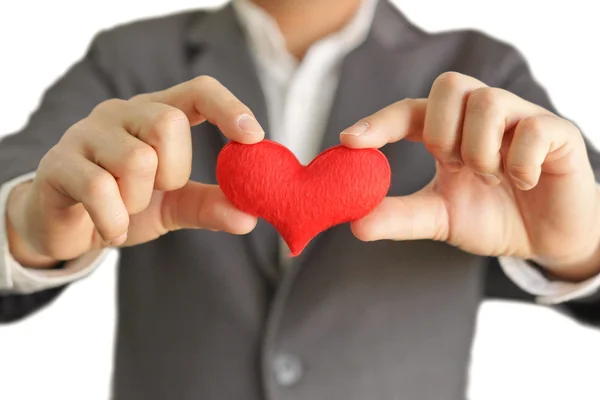 Affärsman ger ett rött hjärta — Stockfoto