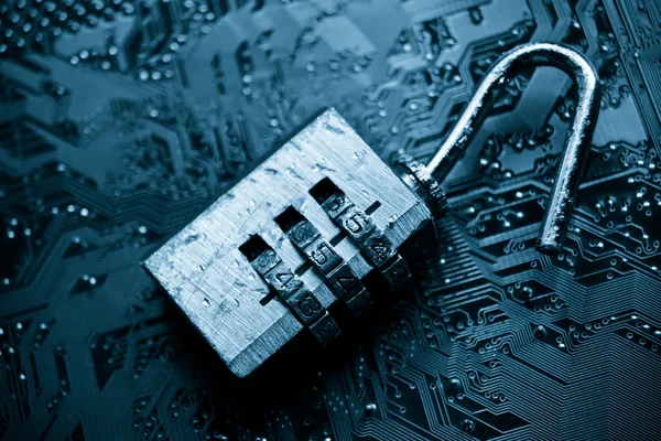 Unlock security lock on circuit board — Stock Photo, Image