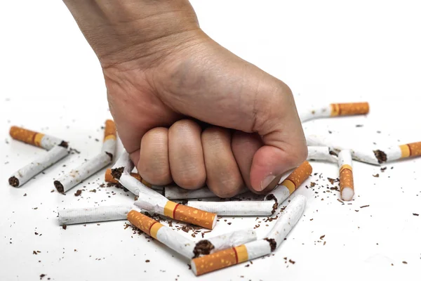 Male hand destroying cigarettes on white — Stock Photo, Image