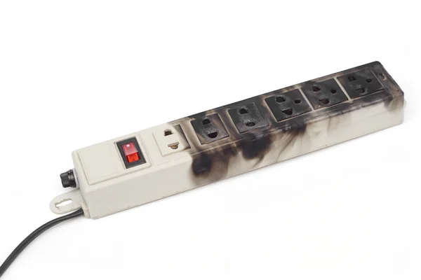 Burnt surge protector on white — Stock Photo, Image