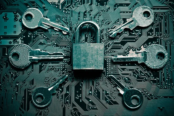 Security lock on circuit board with keys — Stock Photo, Image