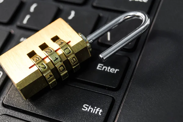 Unlocked security lock on keyboard — Stock Photo, Image