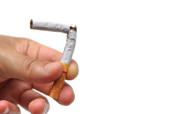 Hand destroying cigarette on white — Stock Photo, Image