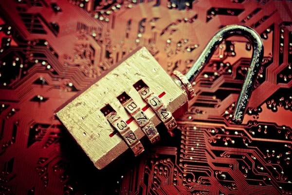 Unlock security lock on circuit board — Stock Photo, Image