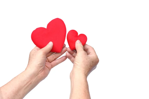 Hands holding red hearts — Stock Photo, Image