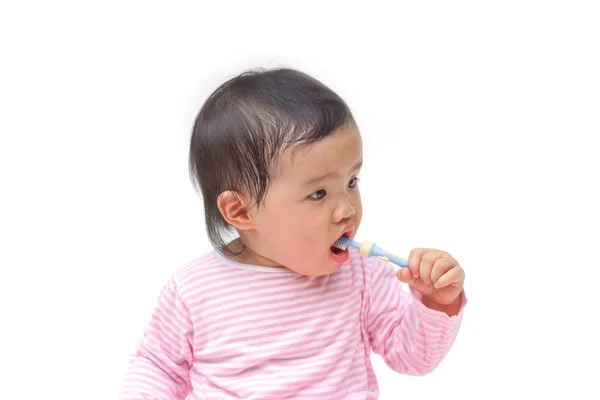 Young Asian baby brushing teeth — Stock Photo, Image