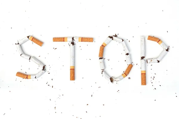 Cigarette arranged as a word stop — Stock Photo, Image