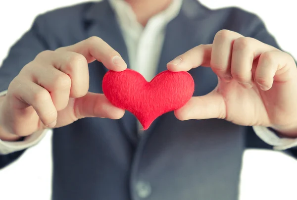 Empresario da un corazón rojo — Foto de Stock