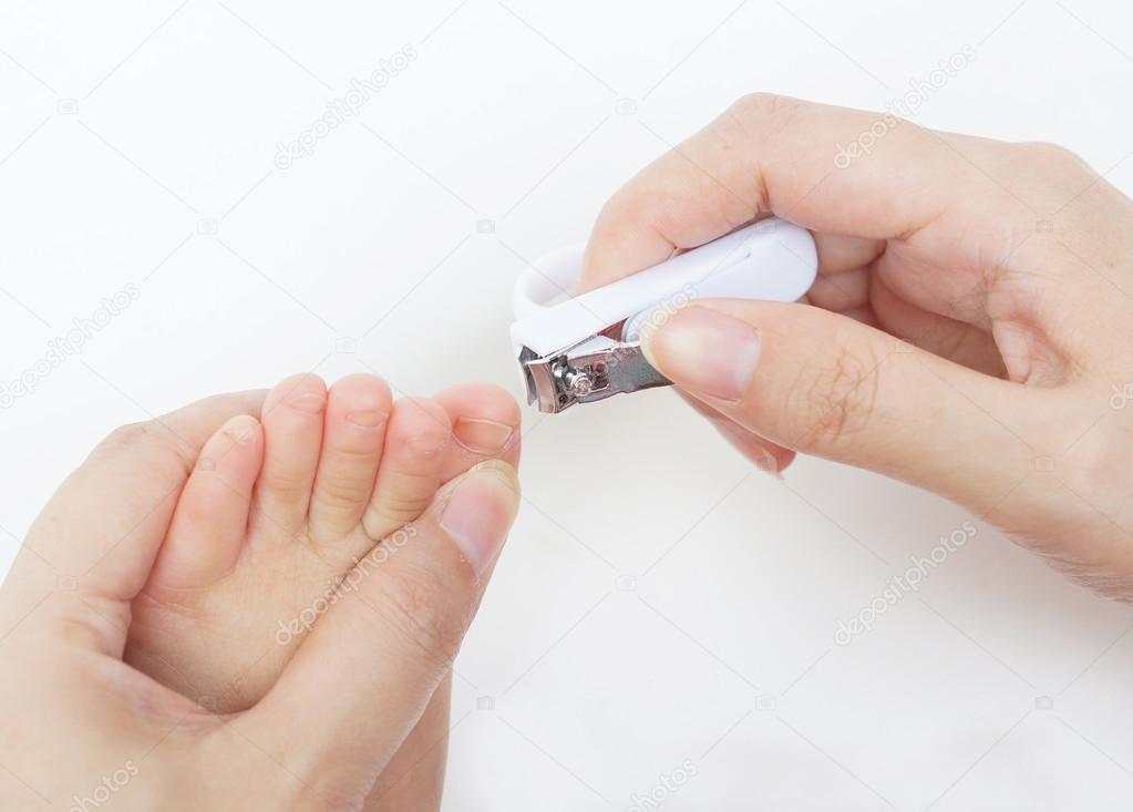 Cutting baby's toe nails on white Stock Photo by ©weerapat 72567287 Cutting baby's toe nails on white Stock Photo by ©weerapat 72567287