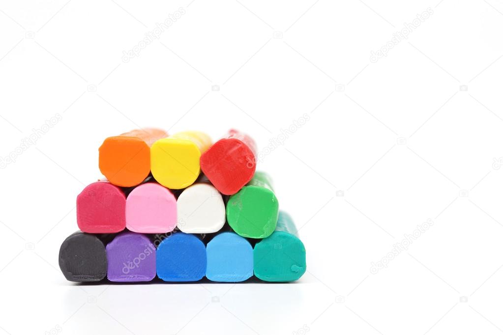 Colorful clay for children on white