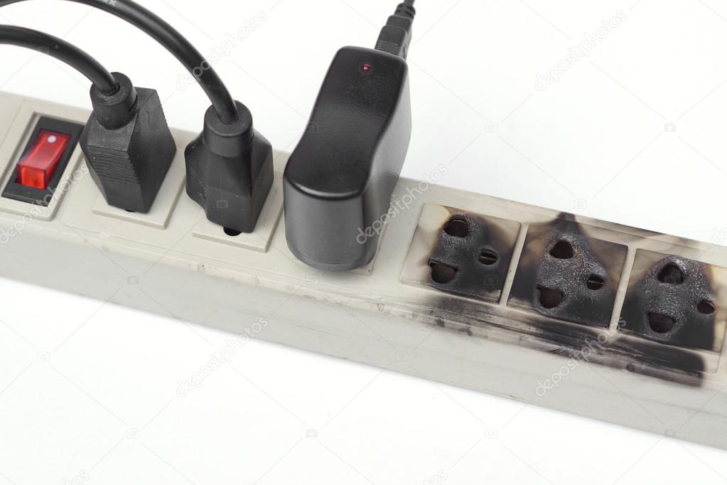 Pictures surge Burnt surge protector on white — Stock Photo