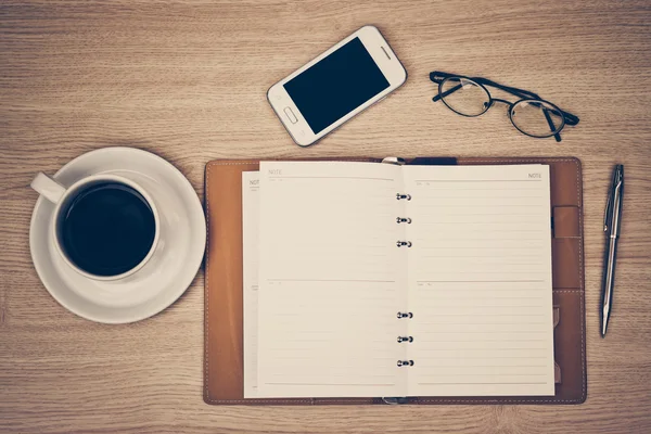 Notebook, smartphone, eye glasses, and pen — Stock Photo, Image