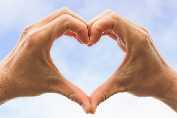 Heart symbol made with two hands — Stock Photo, Image