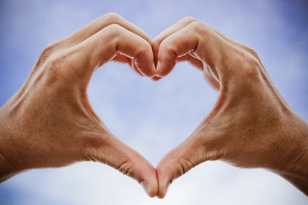 Heart symbol made with two hands — Stock Photo, Image